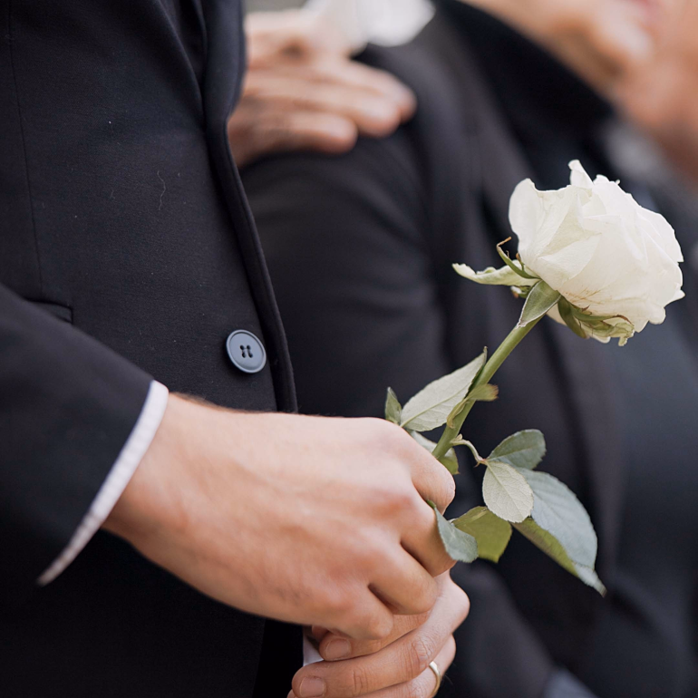 Memorial service setup with photographs and memorabilia